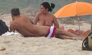 beach , big tits , cougar , handjob , milf , natural , nudist , outdoor , public , voyeur , 