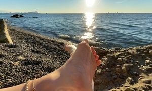 Mistress Lara Plays With Her Feet And Toes On The Beach